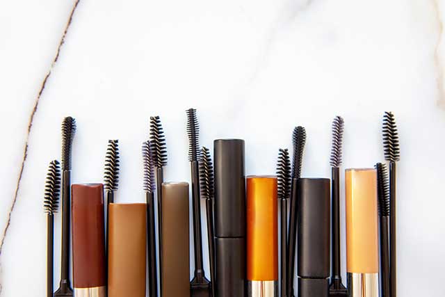 A mascara wand is a small brush attached to the cap of a mascara tube.
