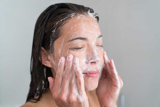Skincare woman washing face